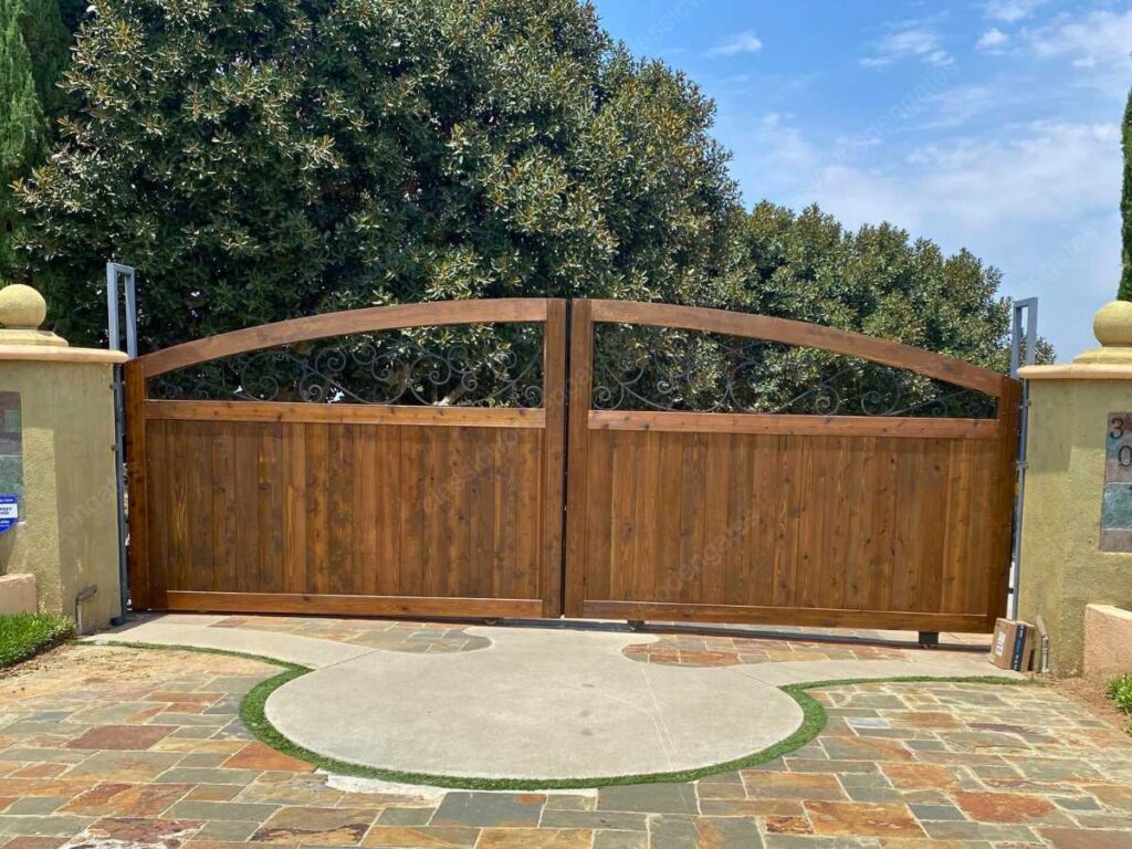 a Mediterranean driveway wooden gate