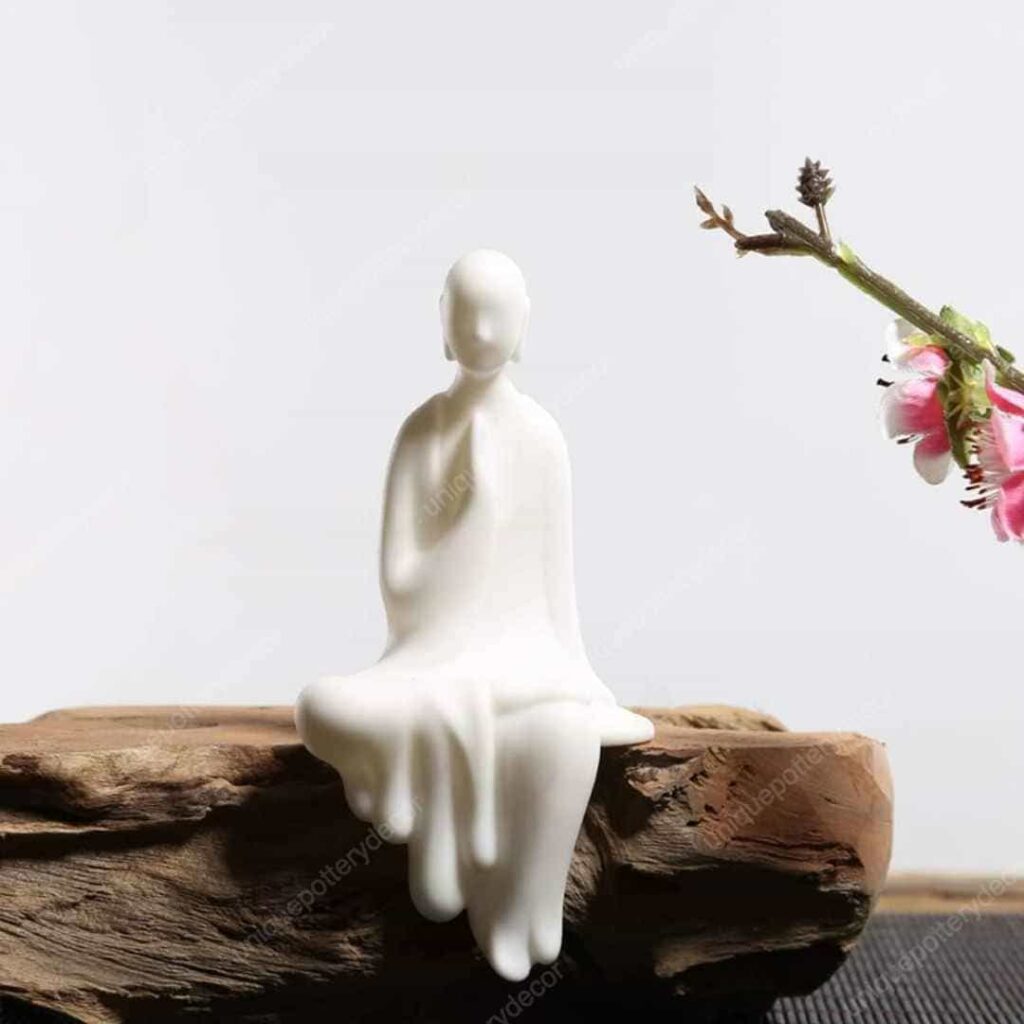 a melting White Ceramic Little Monk