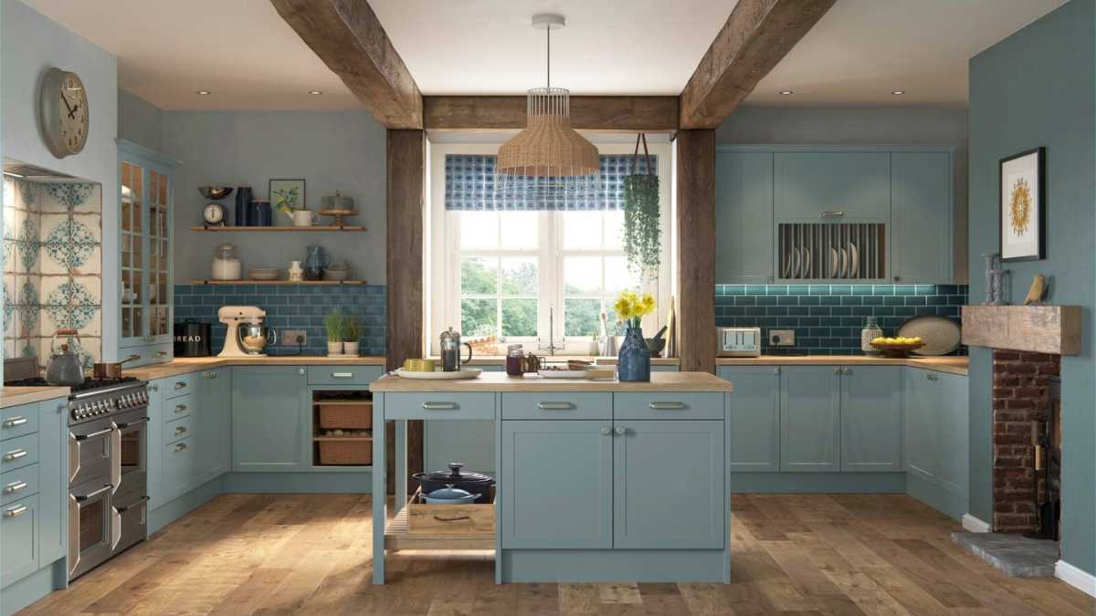 a green kitchen with a kitchen island