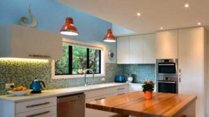 a kitchen with recessed lighting