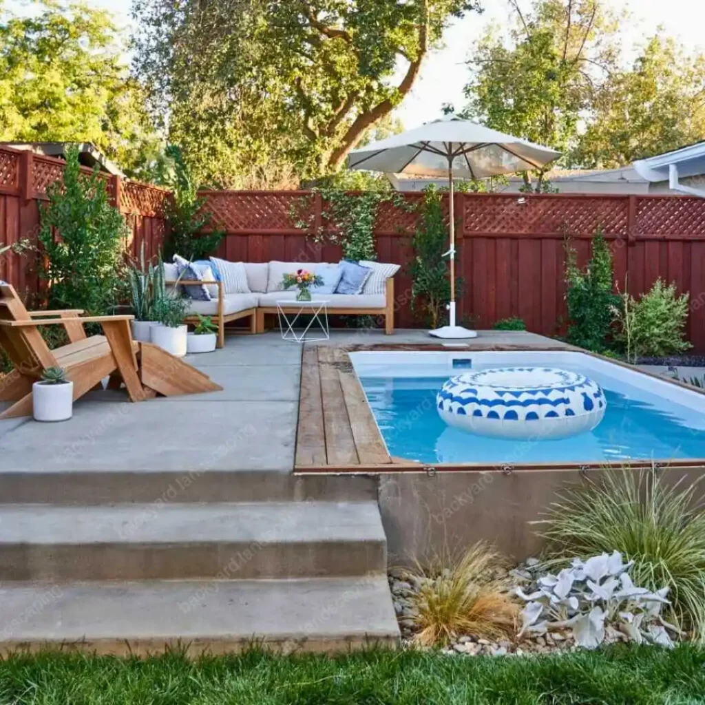 backyard with stone deck and small pool