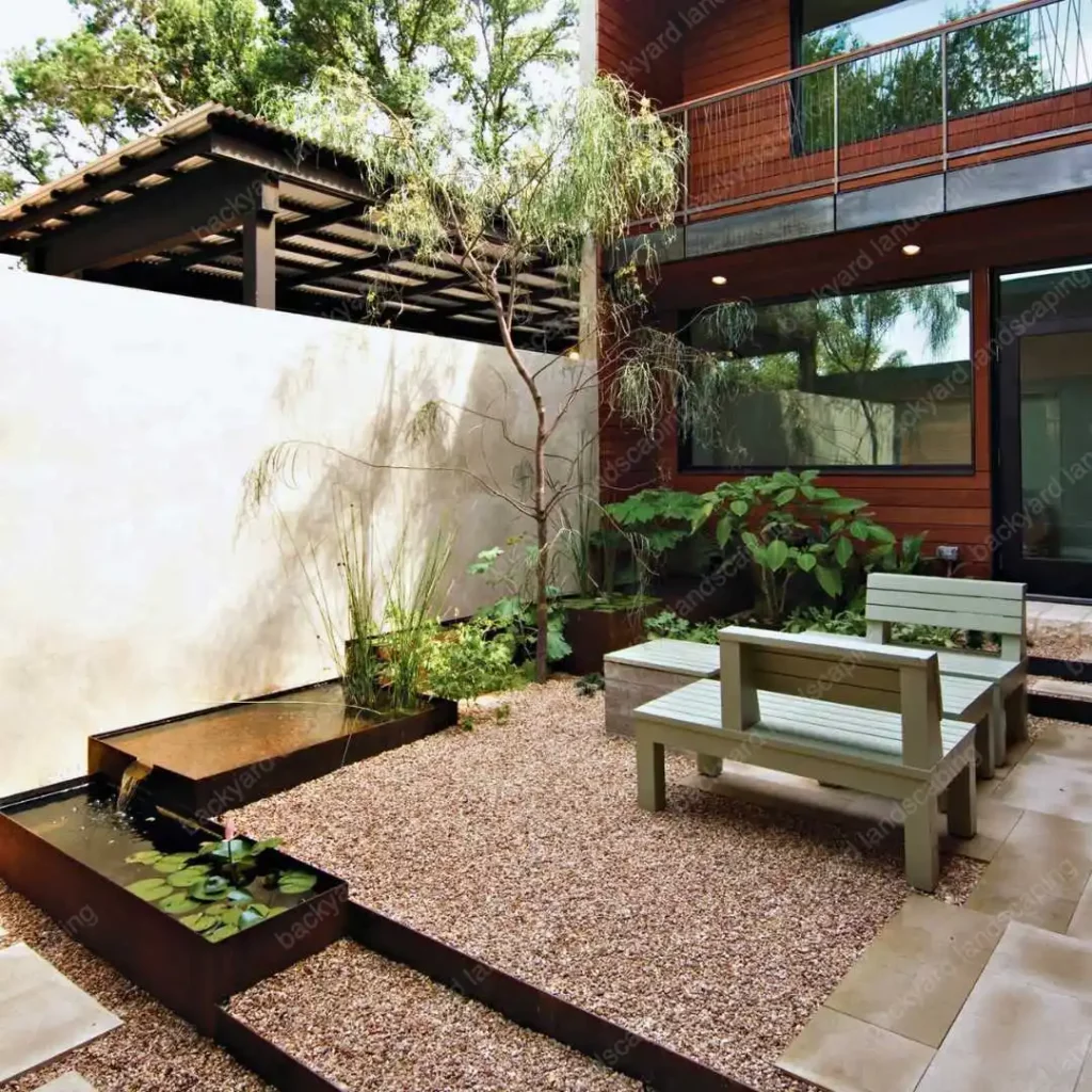 modern backyard landscaping with pebbles