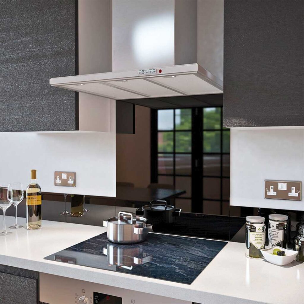 a kitchen with a glass backsplash