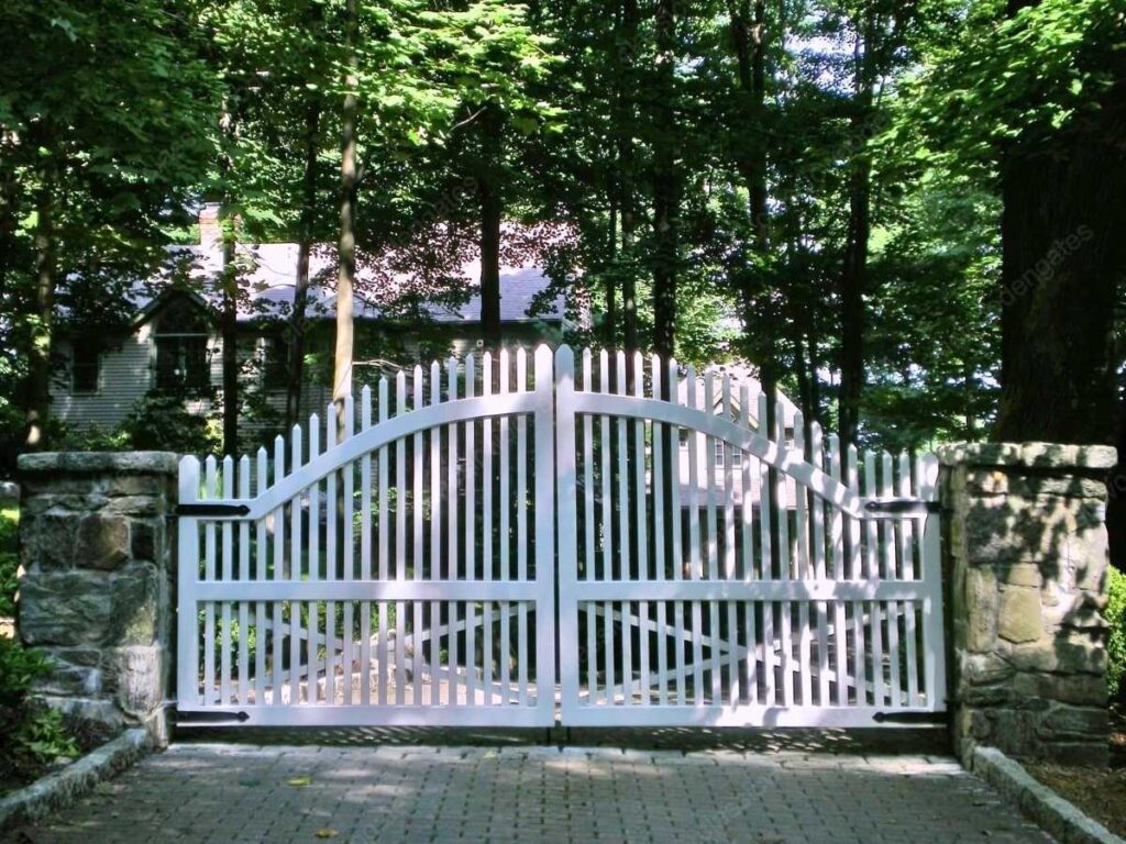 a white wooden driveway picket gate