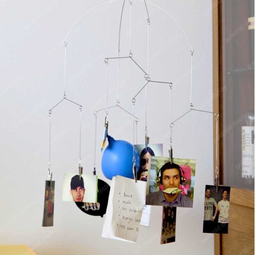 polaroid photo display with hanging mobile