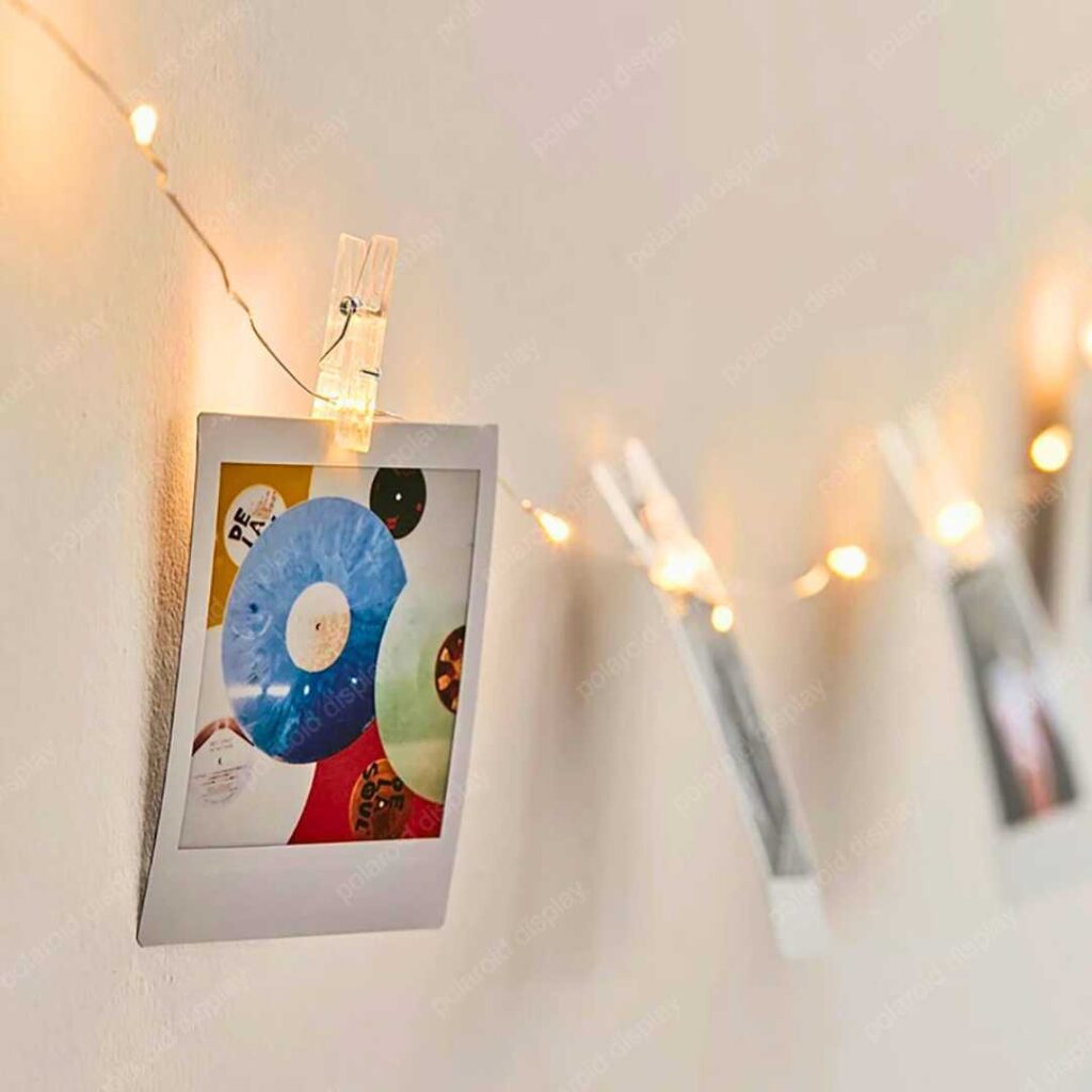 polaroid photo display with string and clip