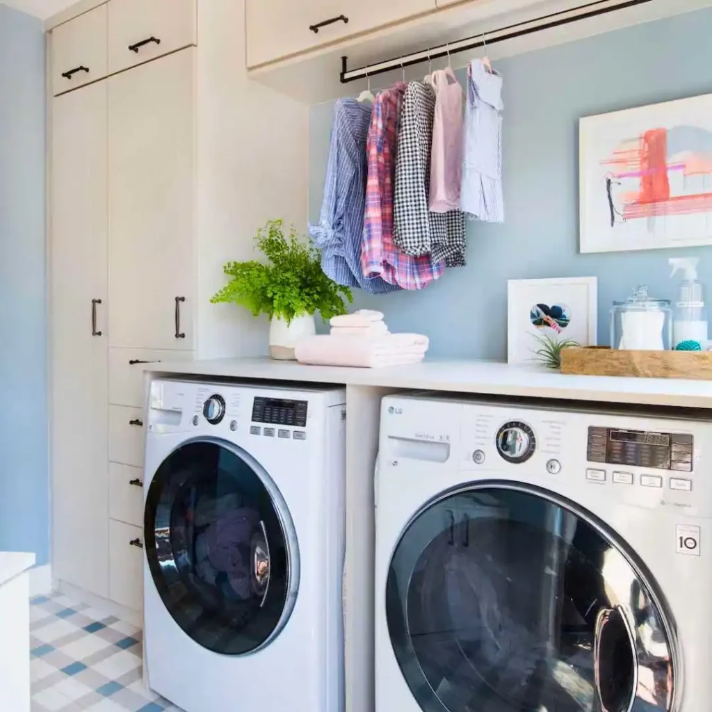 laundry room with light blue wall