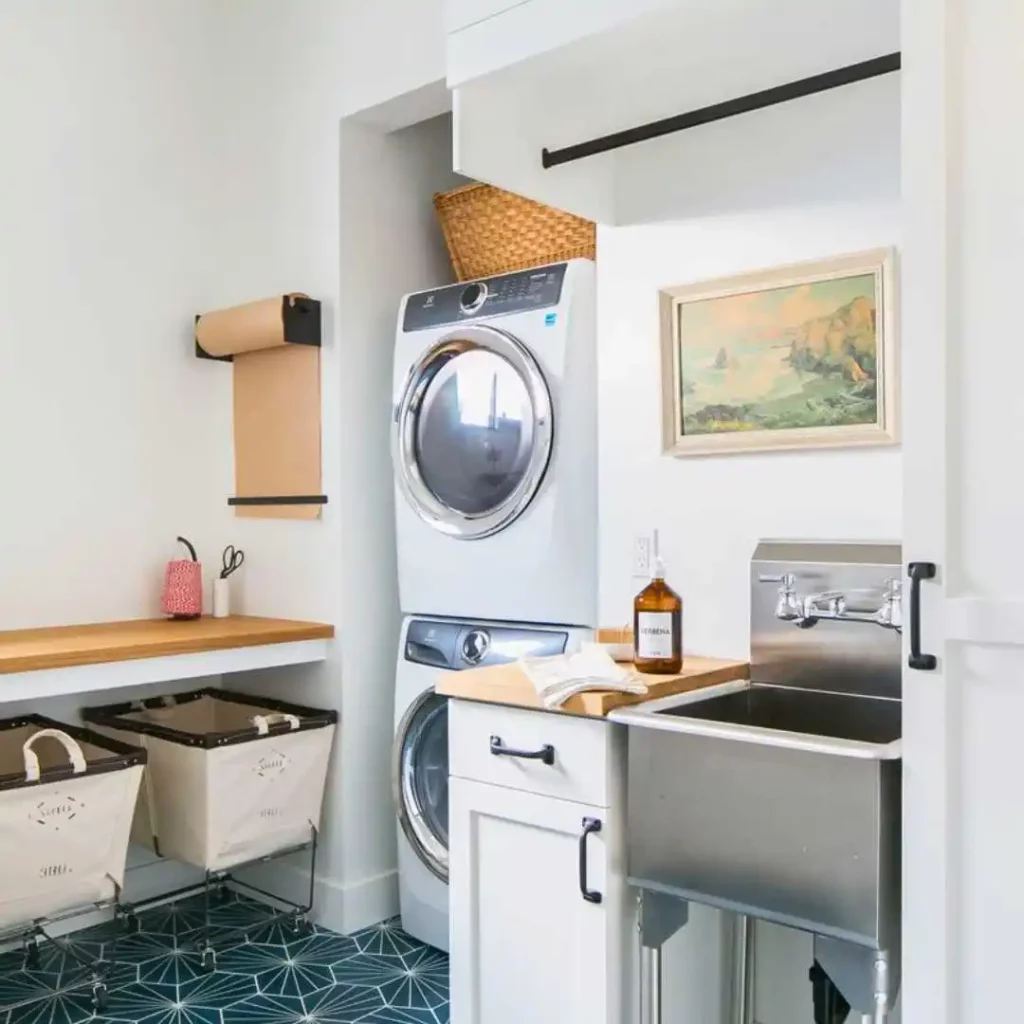 small laundry area with stacked washer and dryer