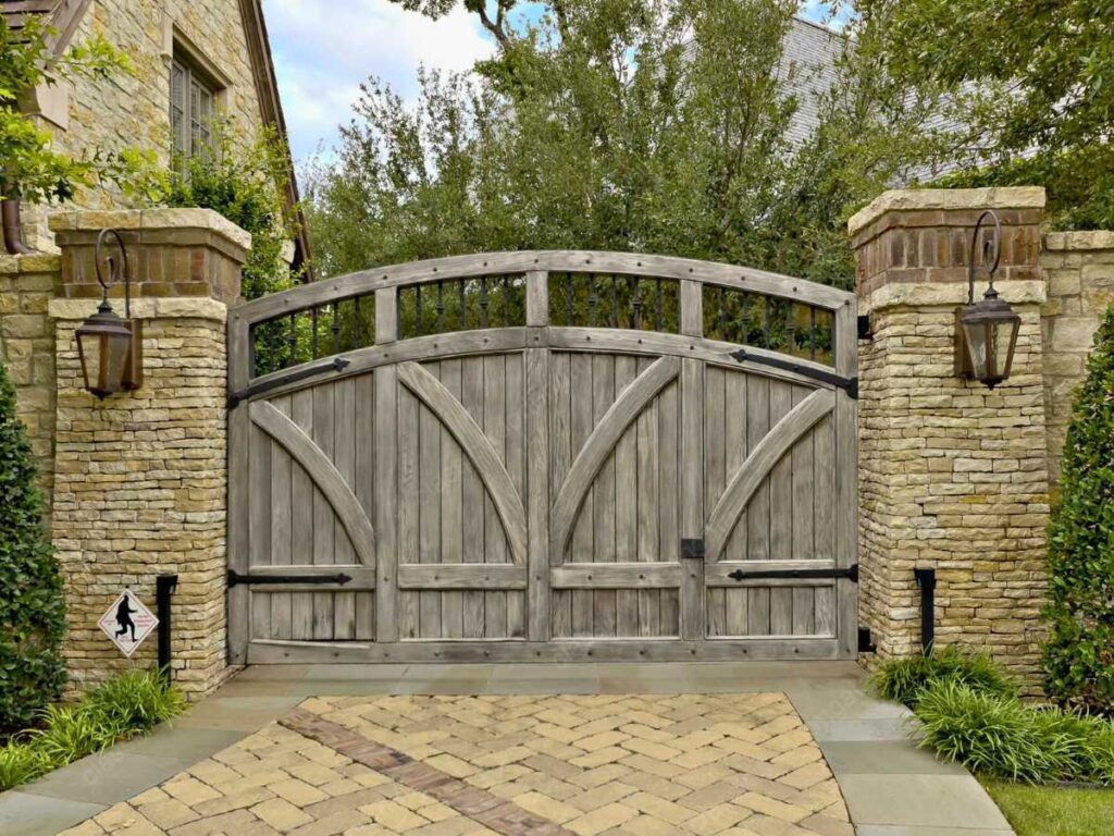 a tudor inspired driveway wooden gate