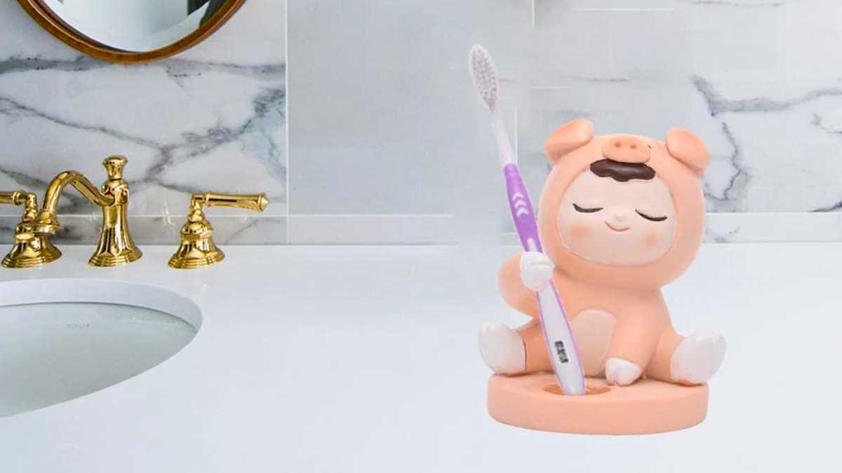 a cute kid in pig dress toothbrush holder