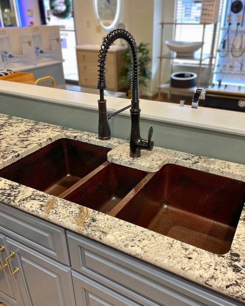 a triple kitchen sink