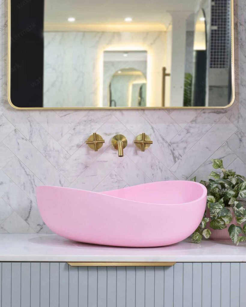 bathroom with pink vessel sink