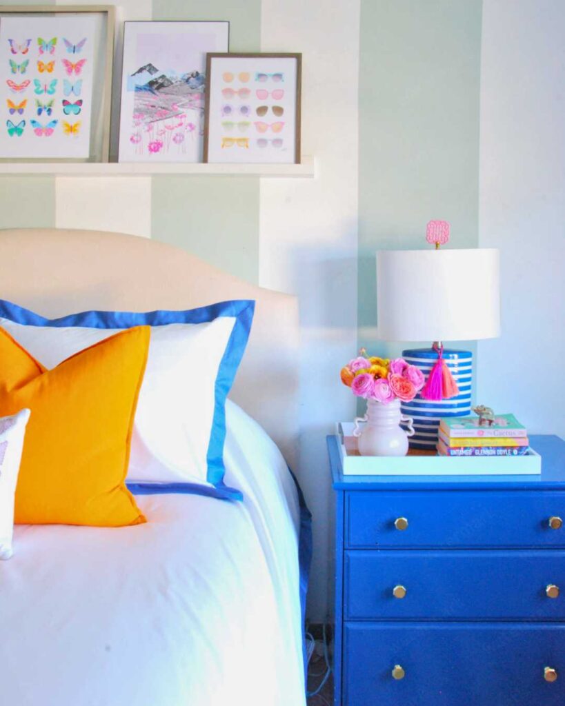 colorful bedroom with blue bedside cabinet