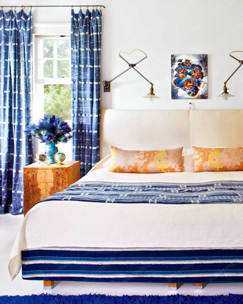 bedroom with patterned blue curtain