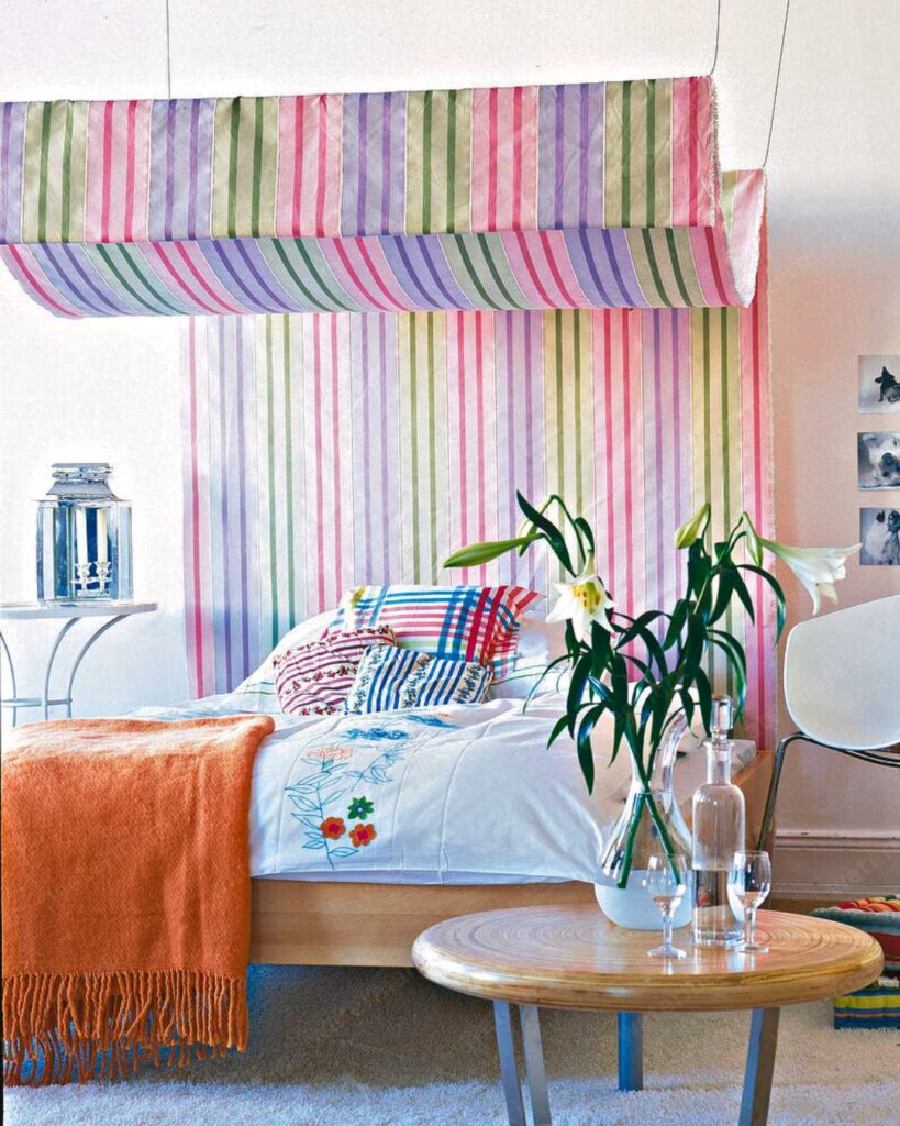 colorful bedroom with stripe canopy