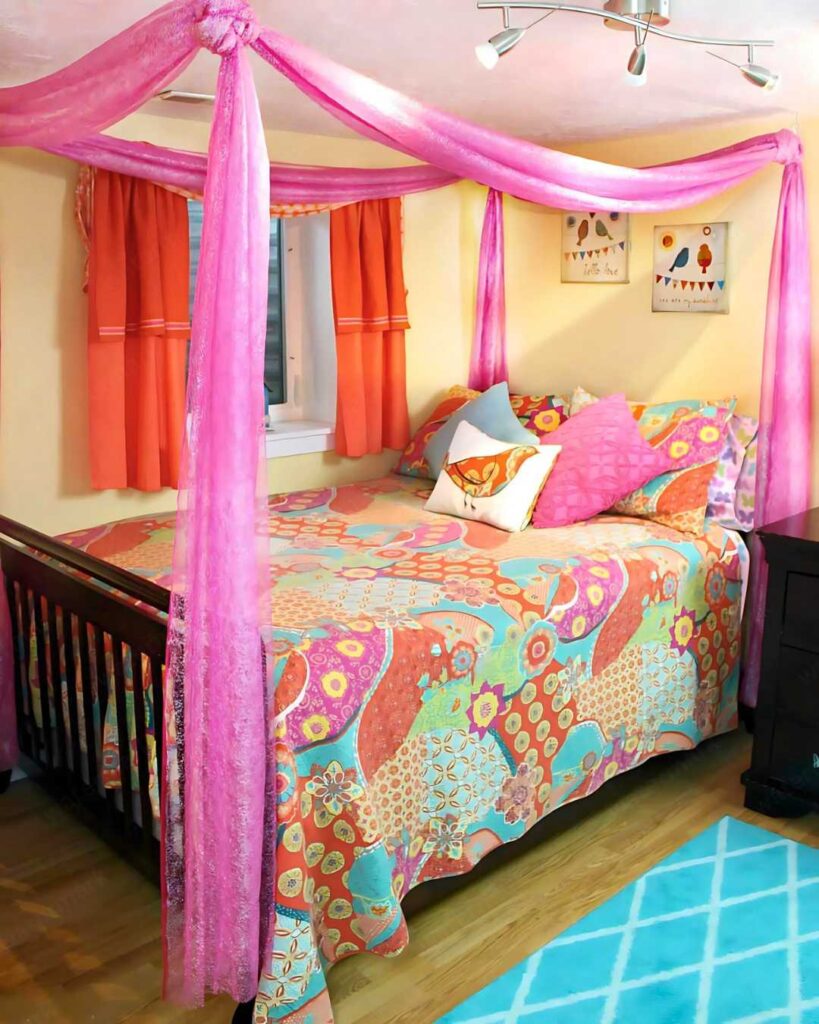 colorful bedroom with pink bed nets