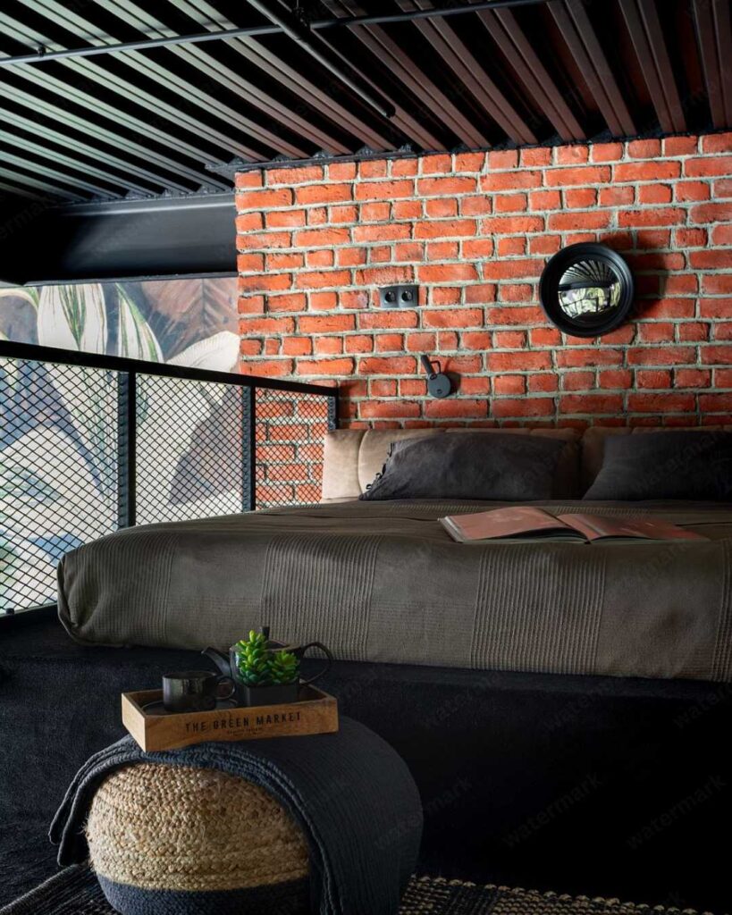 industrial bedroom with brick wall