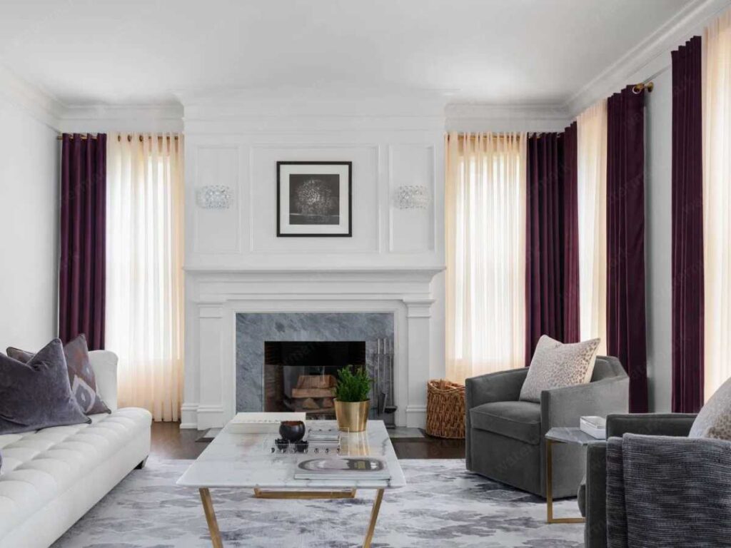 living room with layered window treatment