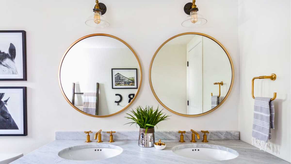 two bathroom mirrors above a vanity