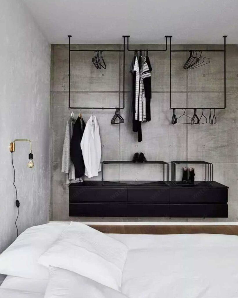 white industrial bedroom with dark accent